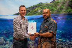 Tourism Fiji CEO Brent Hill with Vodafone Fiji Business Accounts Manager Epeli Raivoka